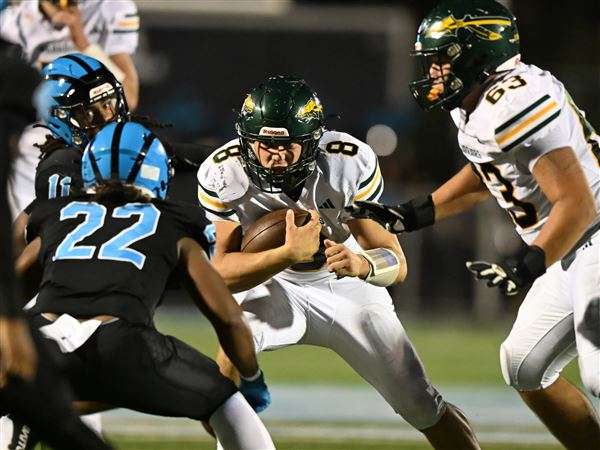 Penn-Trafford's Ben Grabowski carries against Woodland Hills last season.