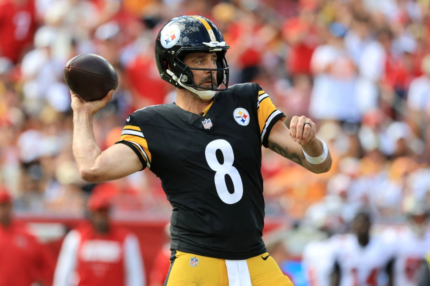 A Paris football game backdrop tied to the Steelers-Saints matchup and security concerns.